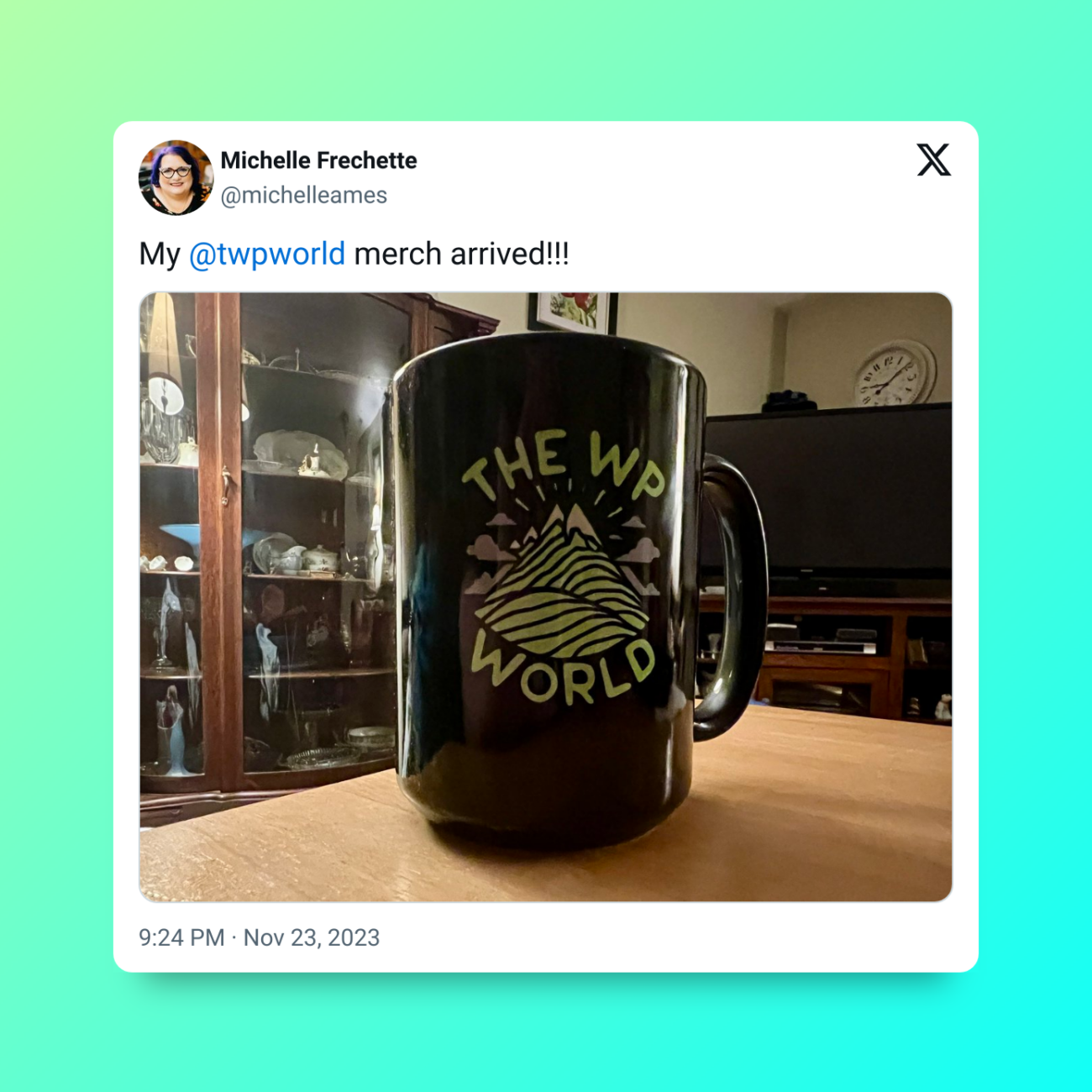 Tweet from Michelle Frechette that says "My @twpworld merch arrived" and includes a photo of her The WP World mug